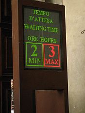 Electric sign outside the Uffizi Gallery giving estimates of the waiting time